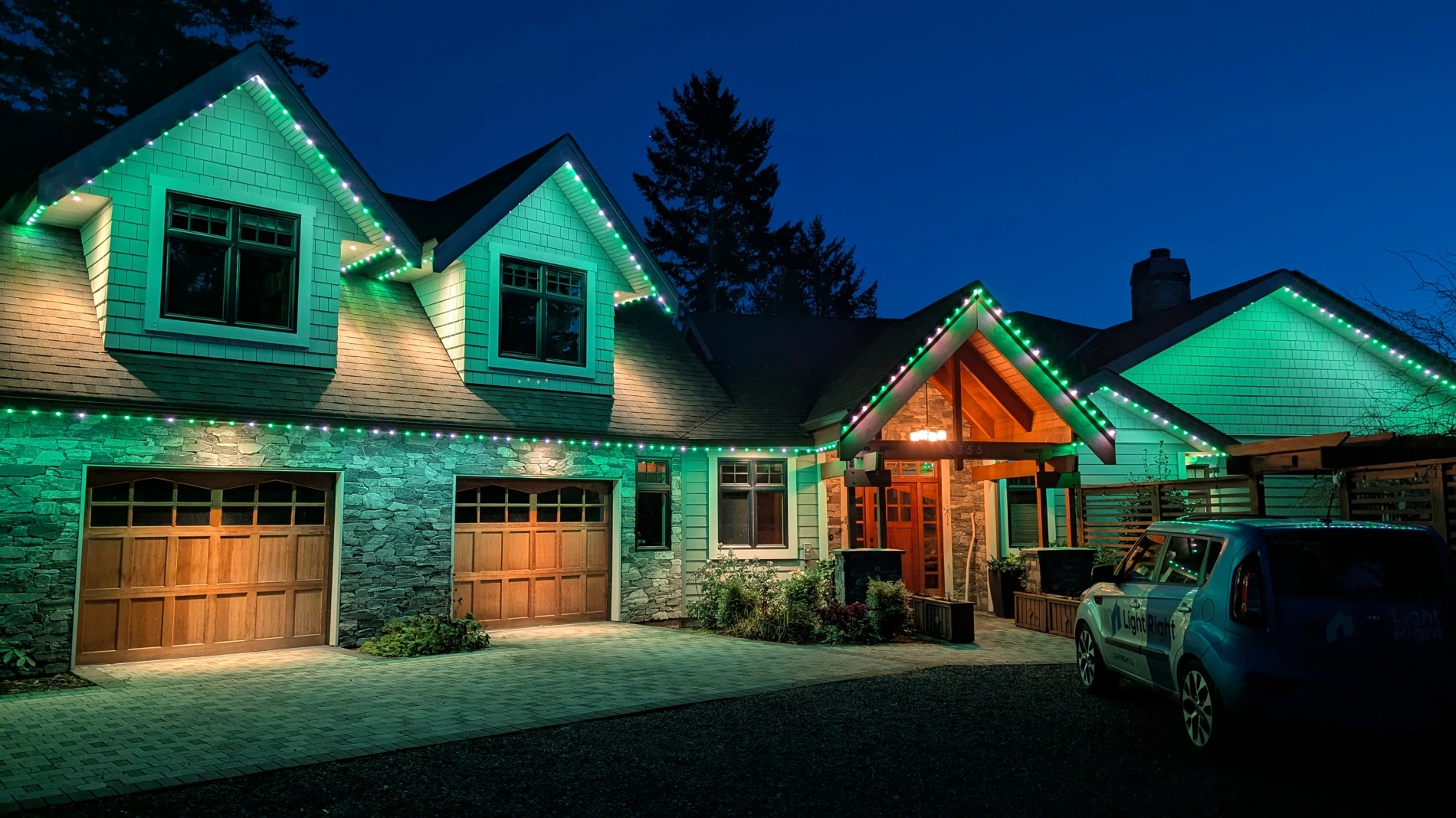 Roofline and garages illuminated with Celebright Permanent Soffit Lighting in Victoria BC