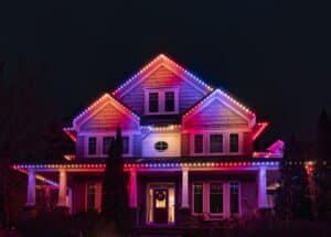 Multiple colours set on a two story home with permanent christmas lighting